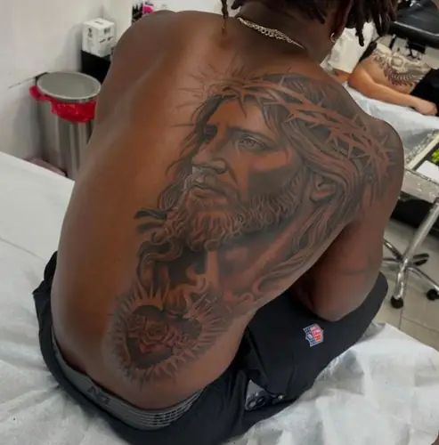Jesus Christ with crown of thorns and sacred heart — large back tattoo