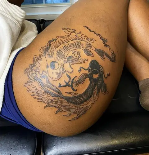 Koi fish yin-yang — thigh tattoo